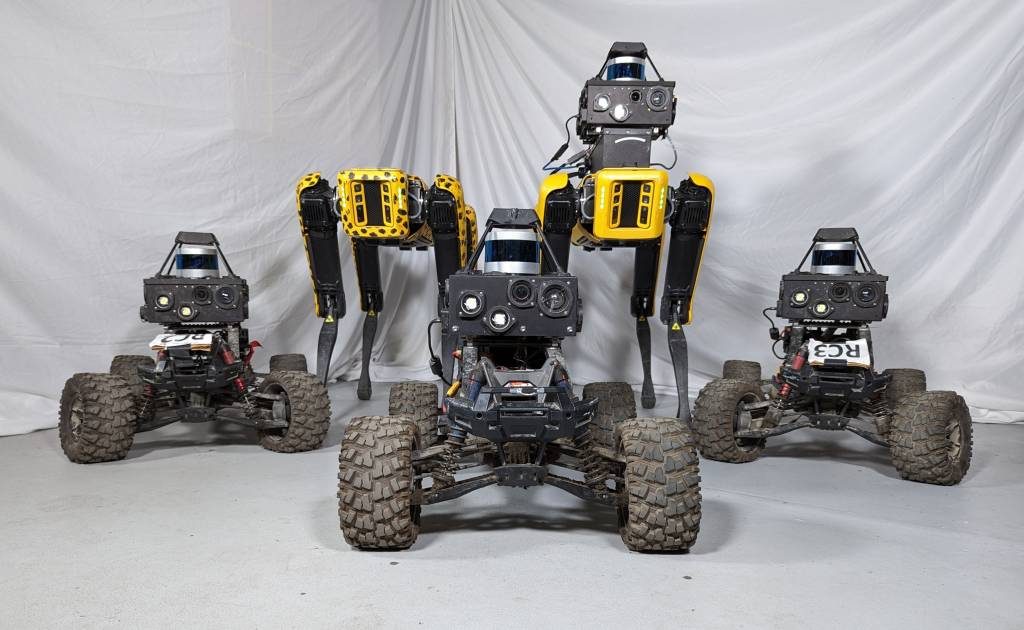 Fleet of three wheeled UGVs and two Spot quadrupeds used in convoy experiments